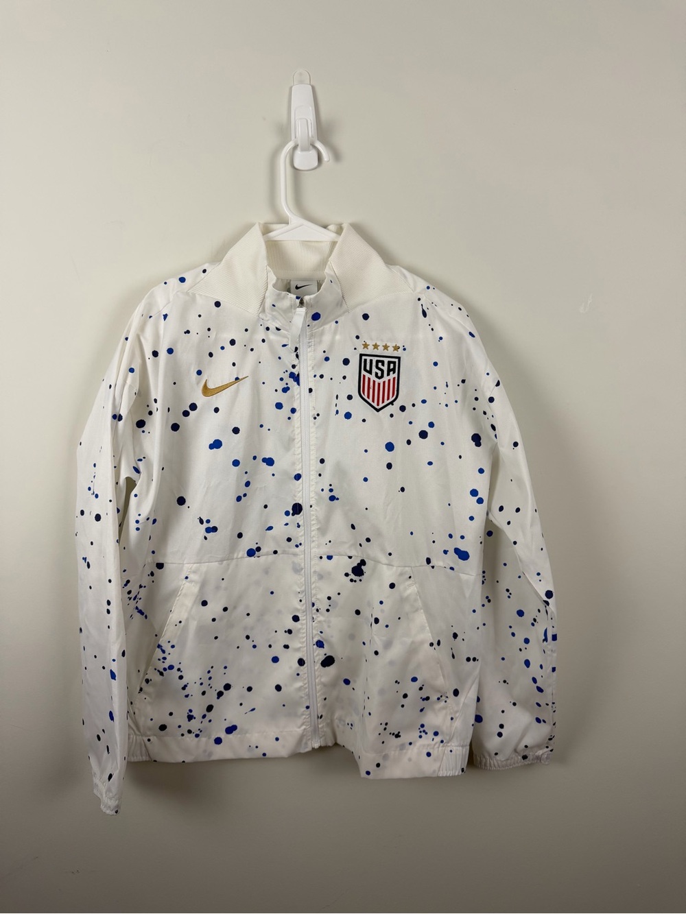 Nike White Jacket with Blue Paint Splatter and Gold Swoosh